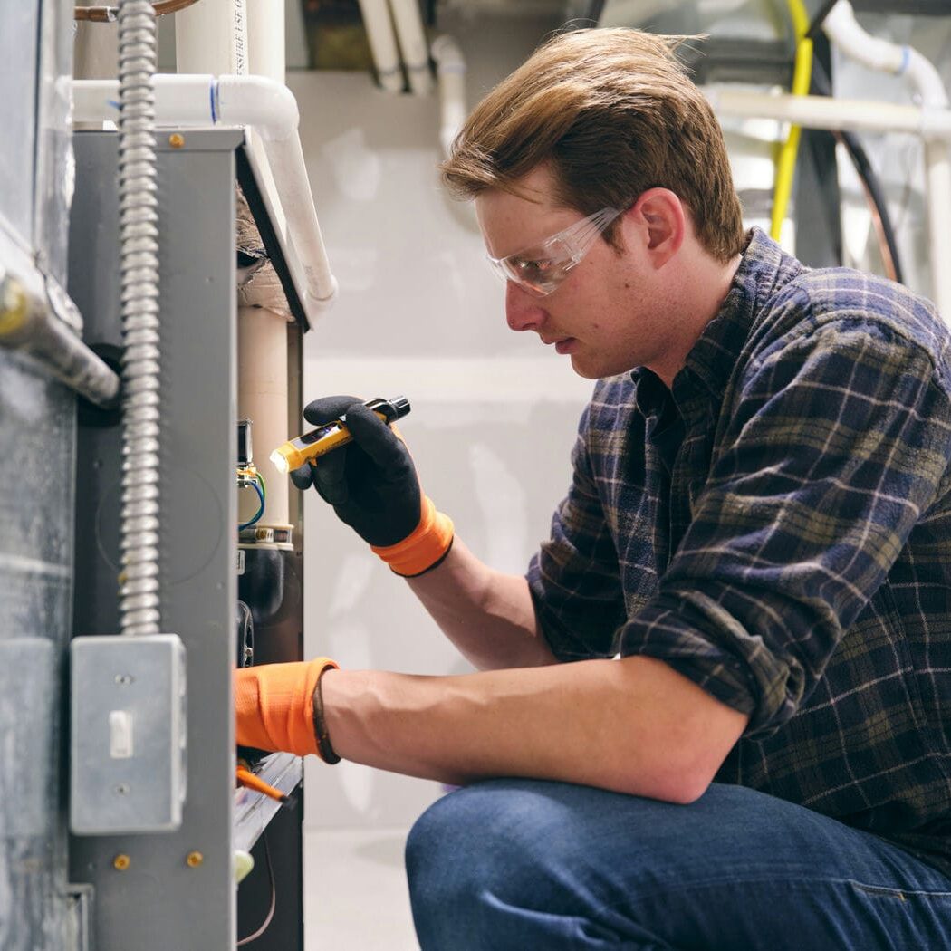 hvac contractor checking furnace